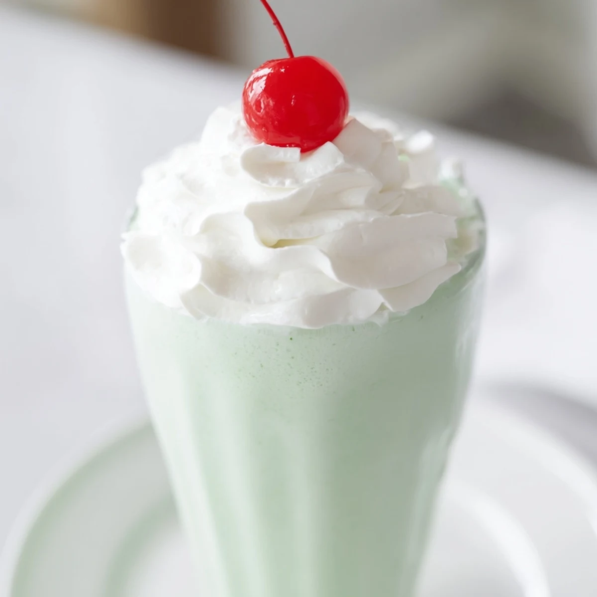 This creamy Mint Milkshake with Maraschino Cherry is blended with peppermint extract for a cool, sweet flavor.