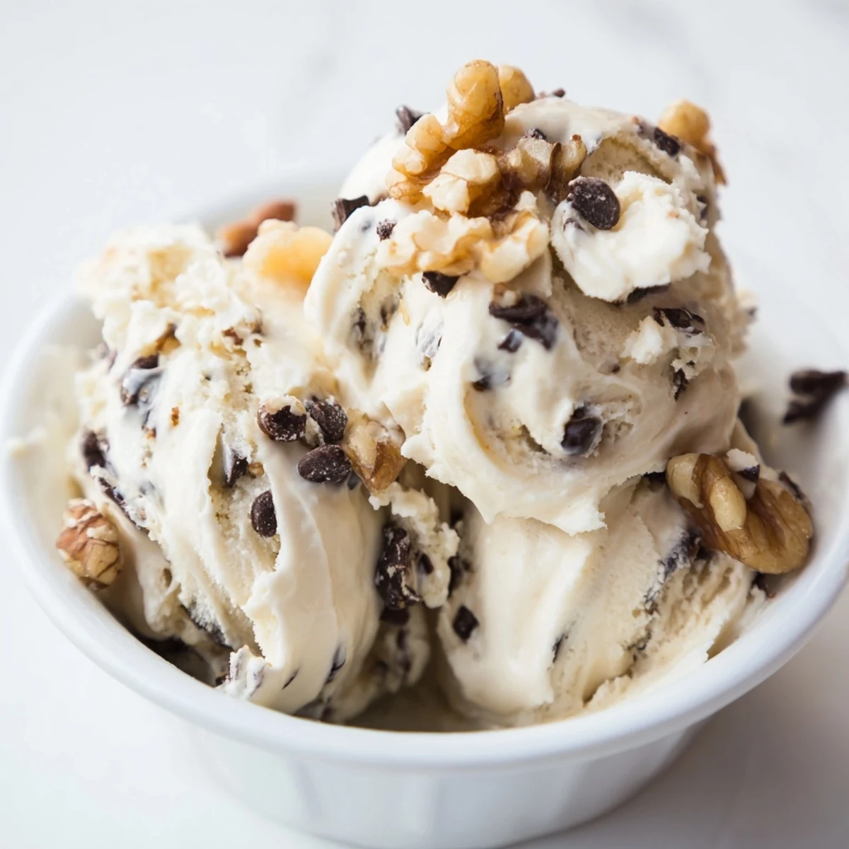 Bright overhead shot shows Guilt Free Greek Yogurt Cookie Dough in a bowl, surrounded by fresh strawberries and pretzels for dipping.