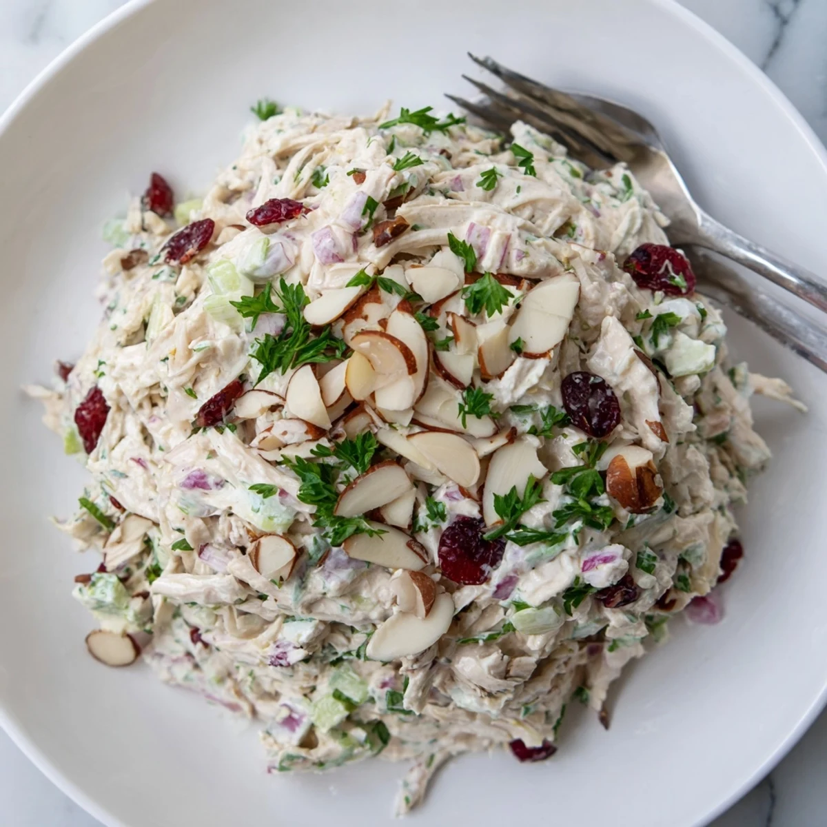 Creamy Greek yogurt rotisserie chicken salad with crisp red bell pepper and fresh parsley