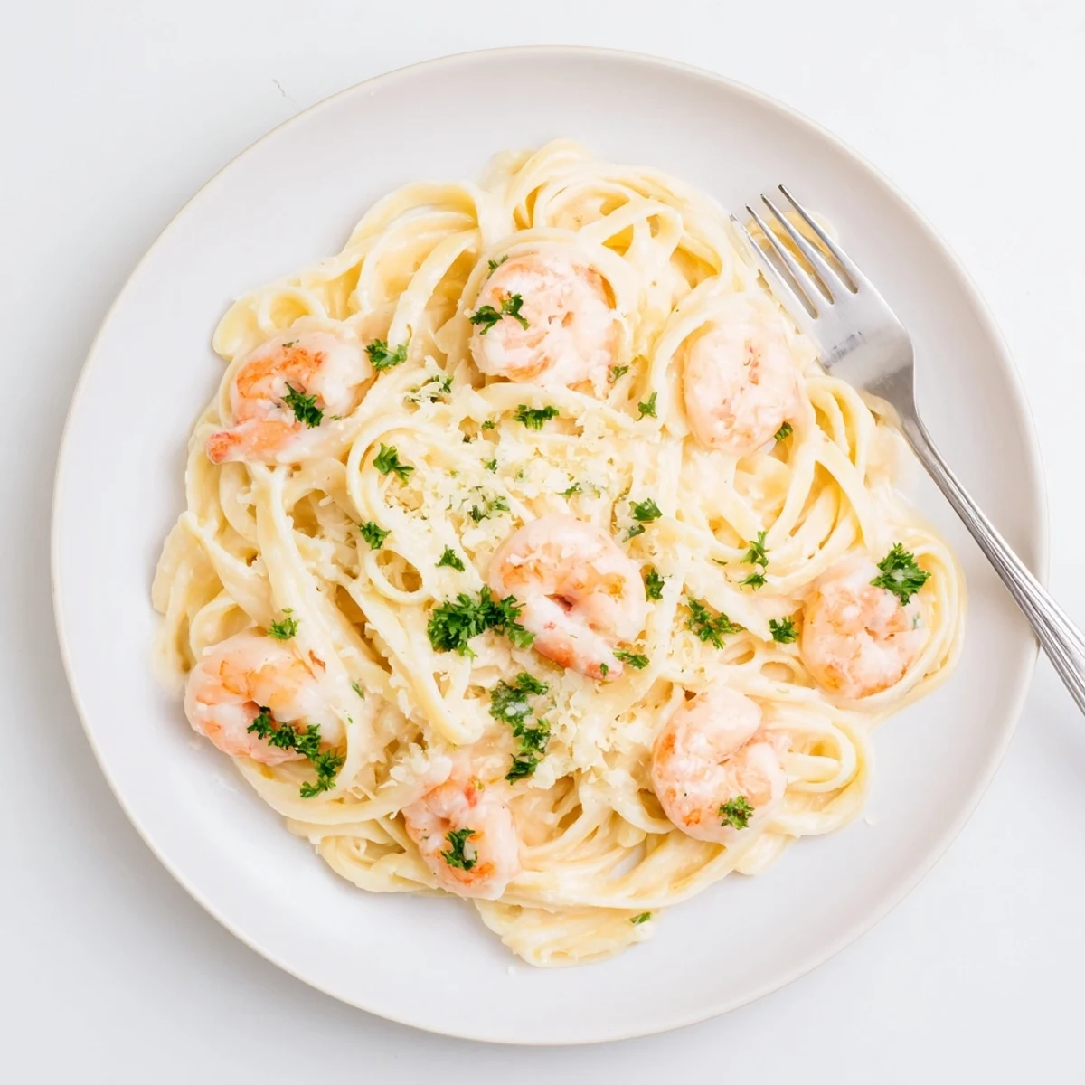 Creamy shrimp scampi garlic cream pasta tossed in silky white wine sauce