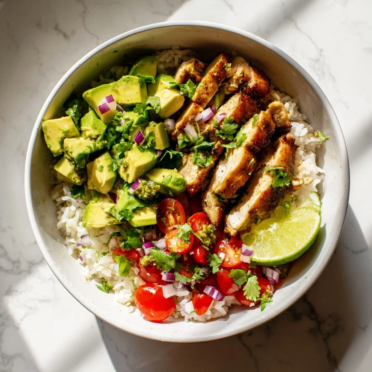 Golden honey lime glazed chicken served over fluffy white rice with creamy diced avocado