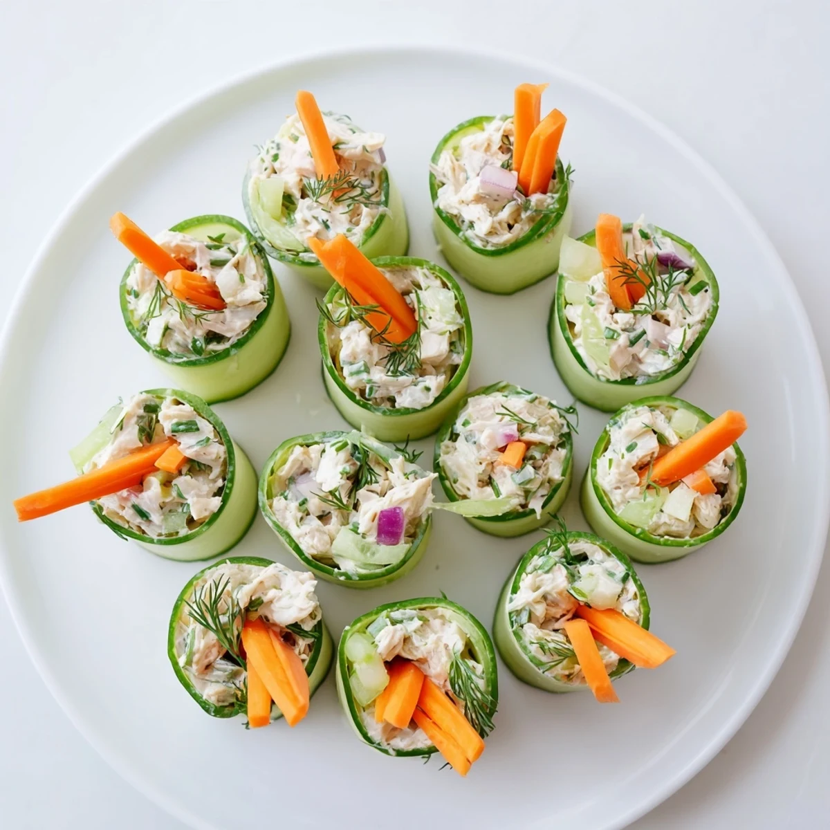 Garden fresh cucumber rolls filled with tangy chicken salad make elegant bite sized appetizers