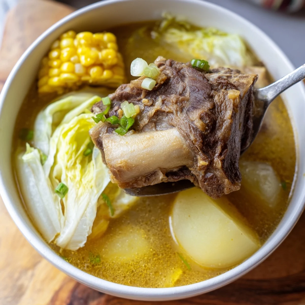 Filipino Bulalo beef shank soup with corn cabbage and rich clear broth