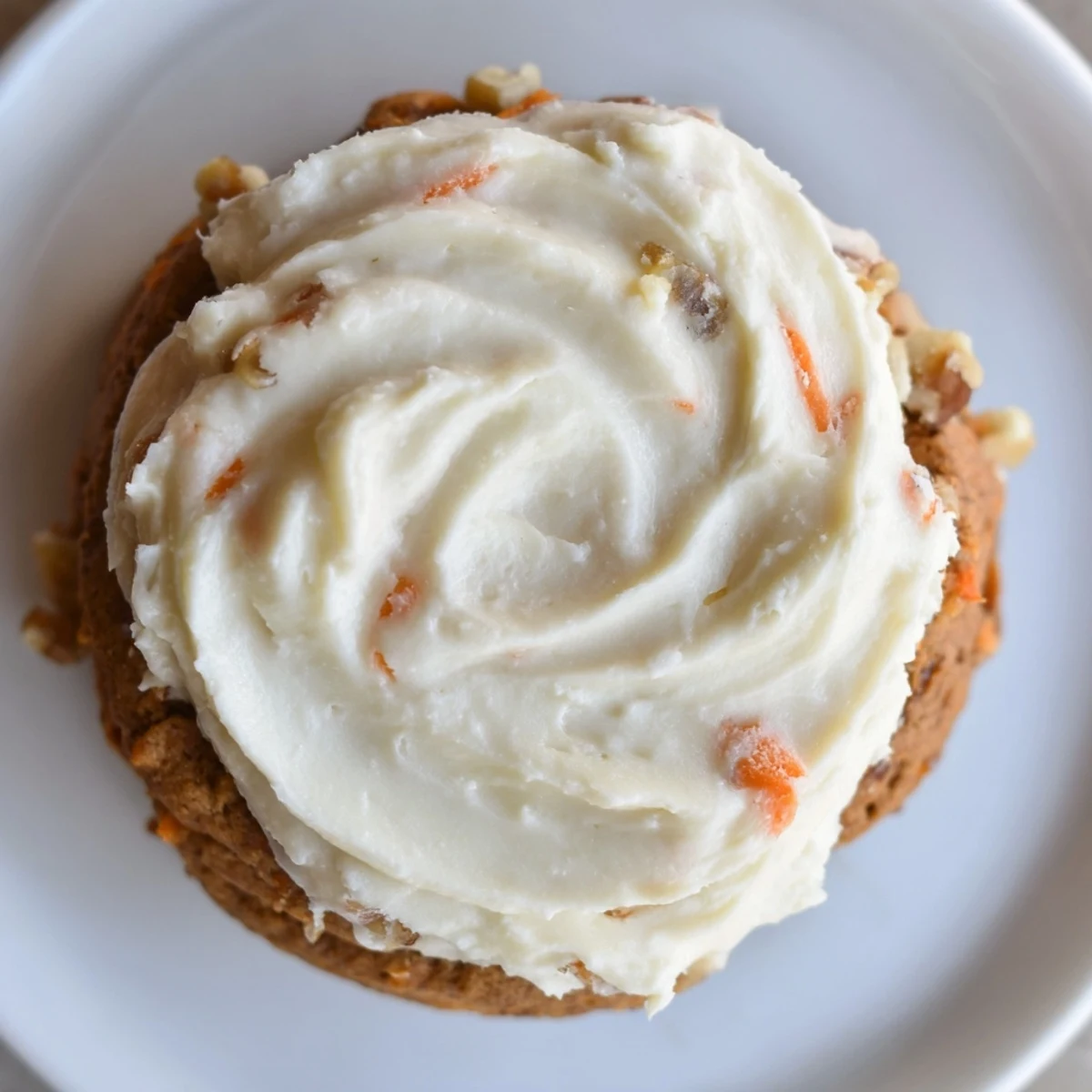 Warm spiced Crumbl carrot cake cookies fresh from the oven on parchment paper