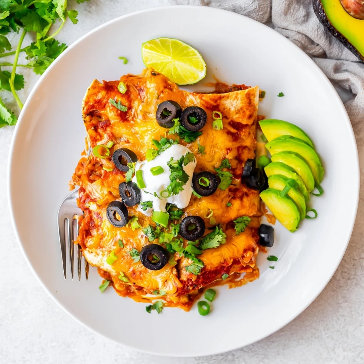 Golden bubbling Cheesy Shredded Chicken Enchilada Bake fresh from the oven with melted cheese