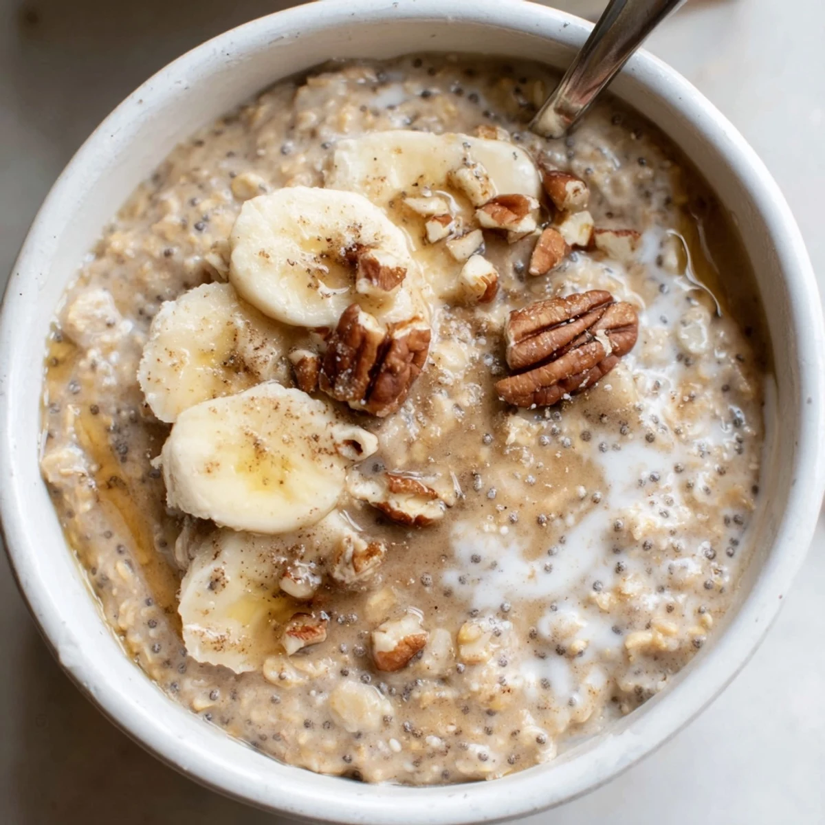 Creamy Brown Sugar Coffee Overnight Oats in mason jar topped with banana