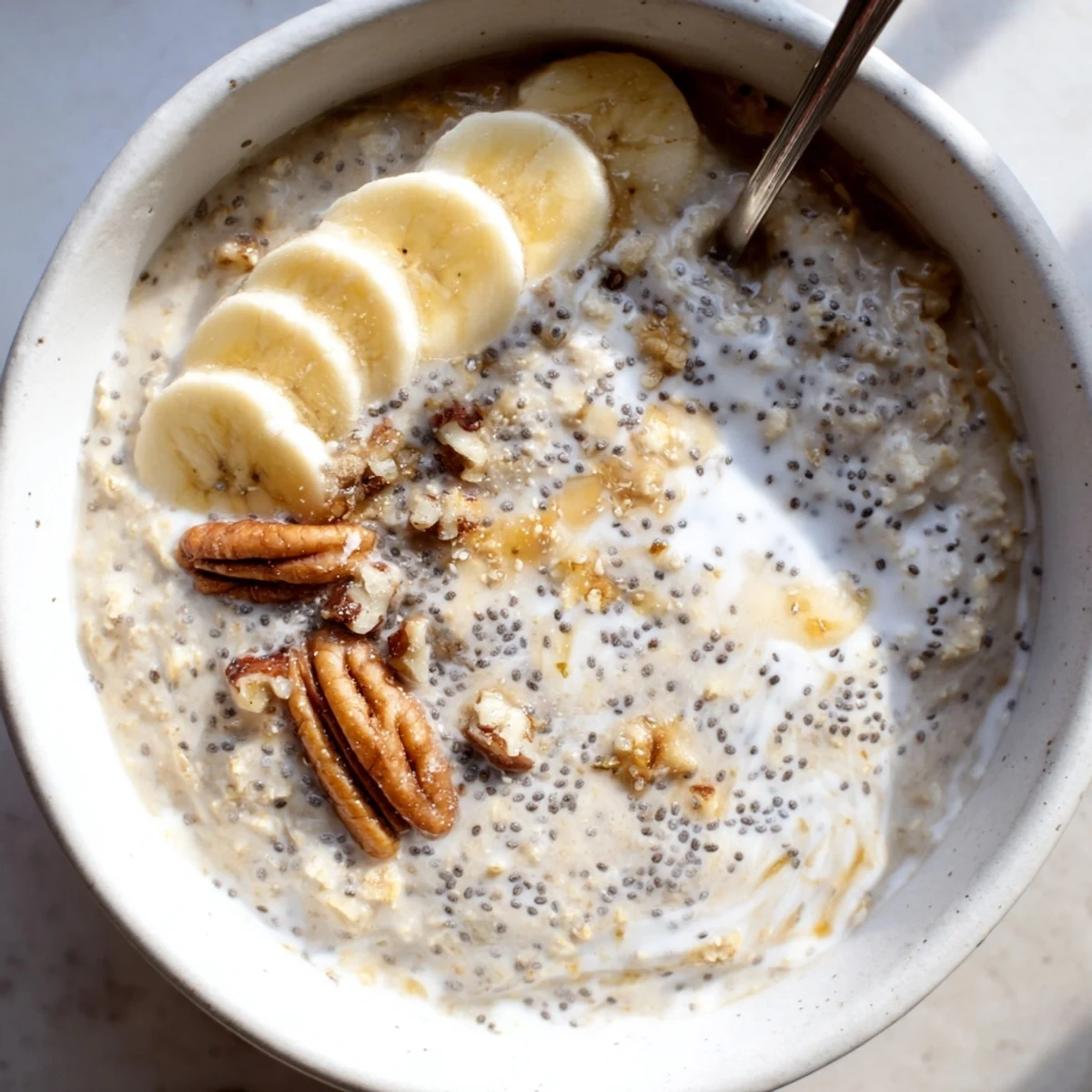 Chilled Brown Sugar Coffee Overnight Oats smelling of espresso, garnished with nuts