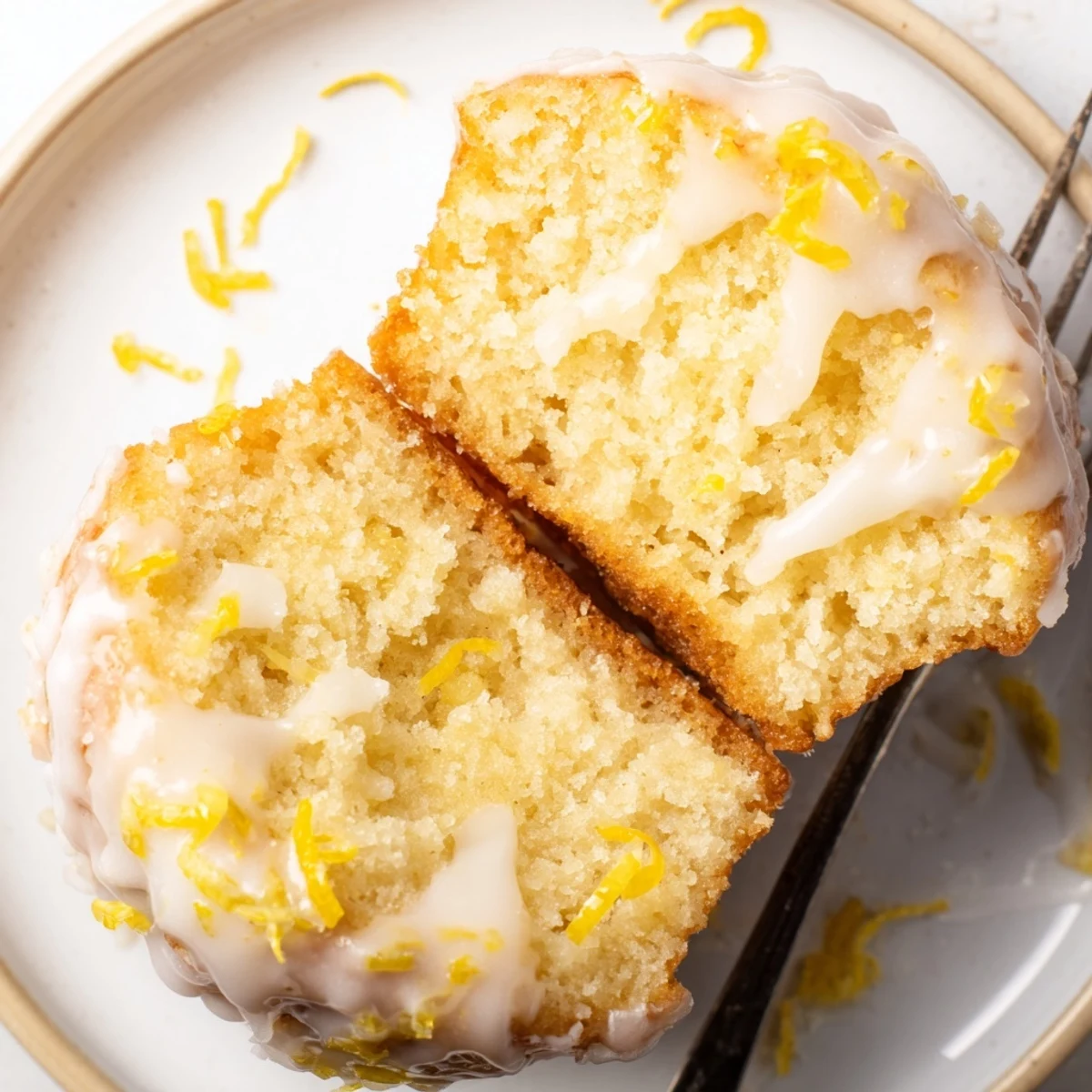 Warm Glazed Lemon Ginger Muffins paired with herbal tea, tangy glaze shining.