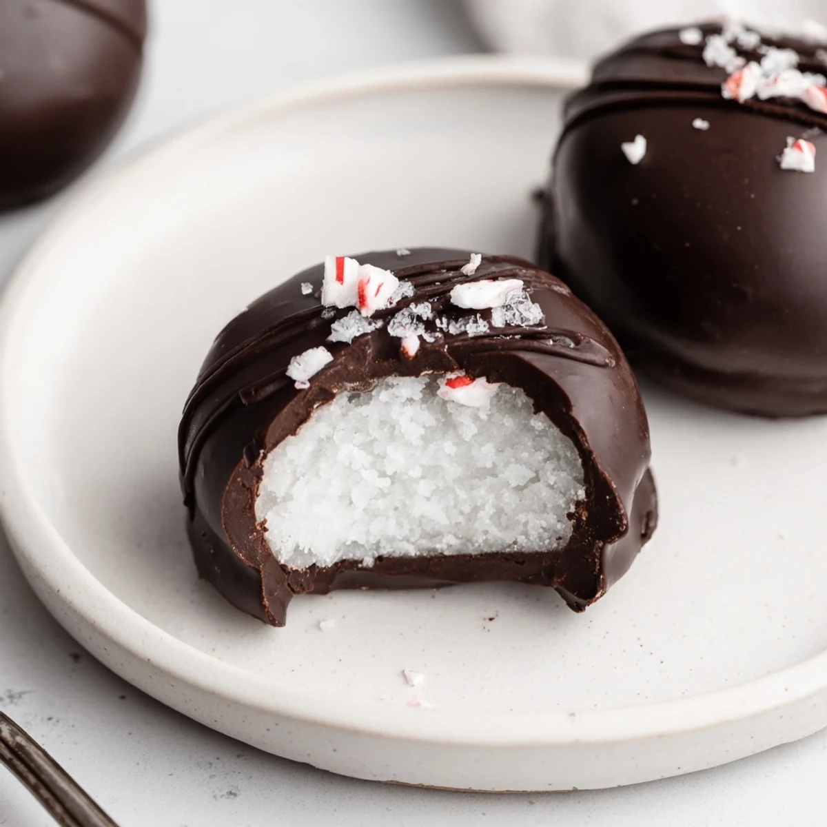 Homemade Peppermint Patties with creamy mint center and rich chocolate sheen.