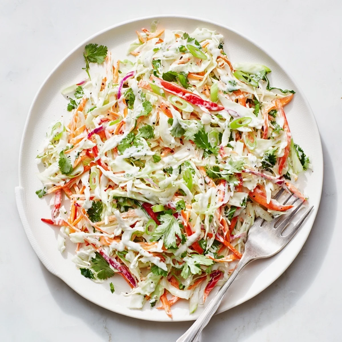 Vibrant summer slow loaded with shredded carrots, bell peppers, and fresh cilantro for picnics