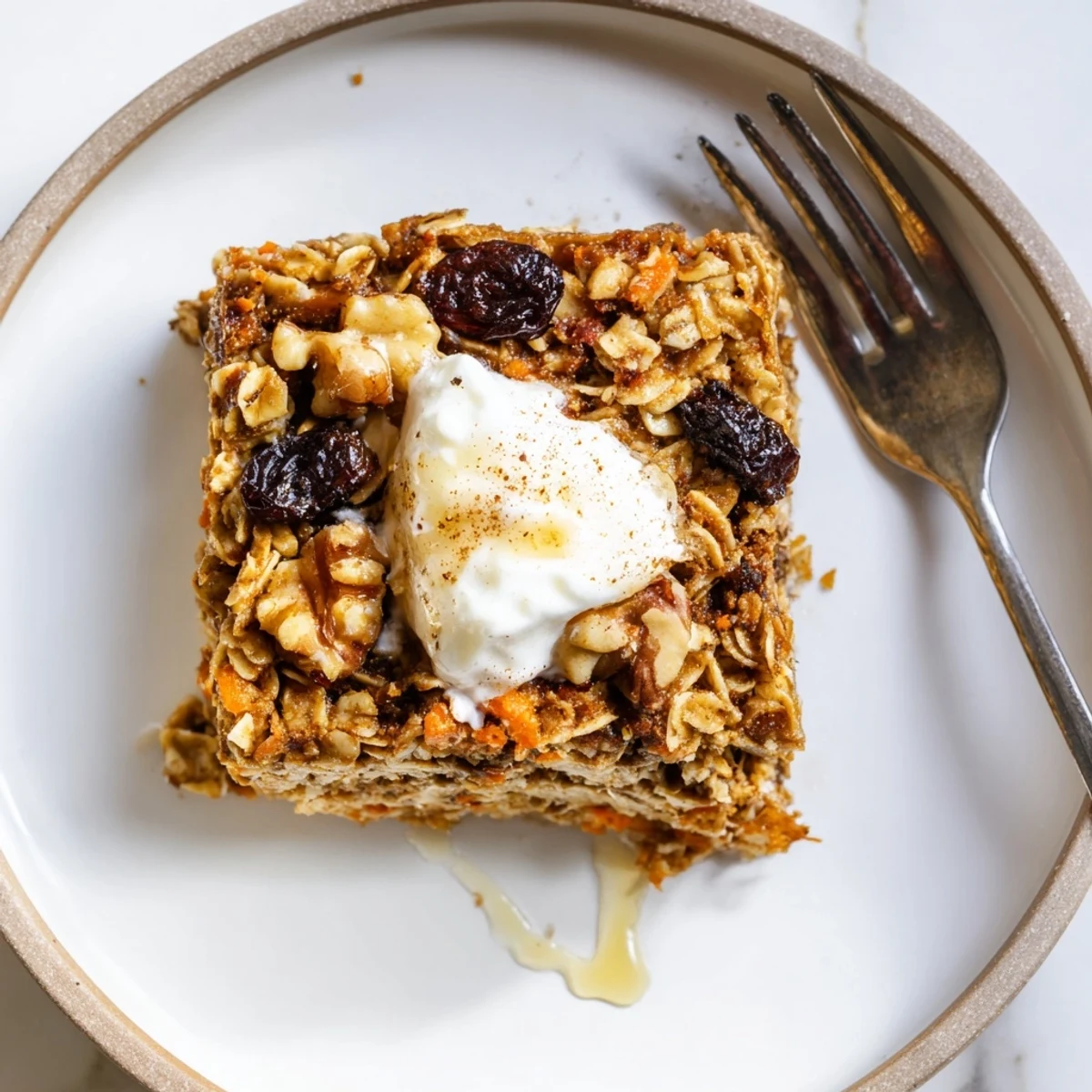 Warm Carrot Cake Baked Oatmeal steaming, speckled with walnuts and raisins