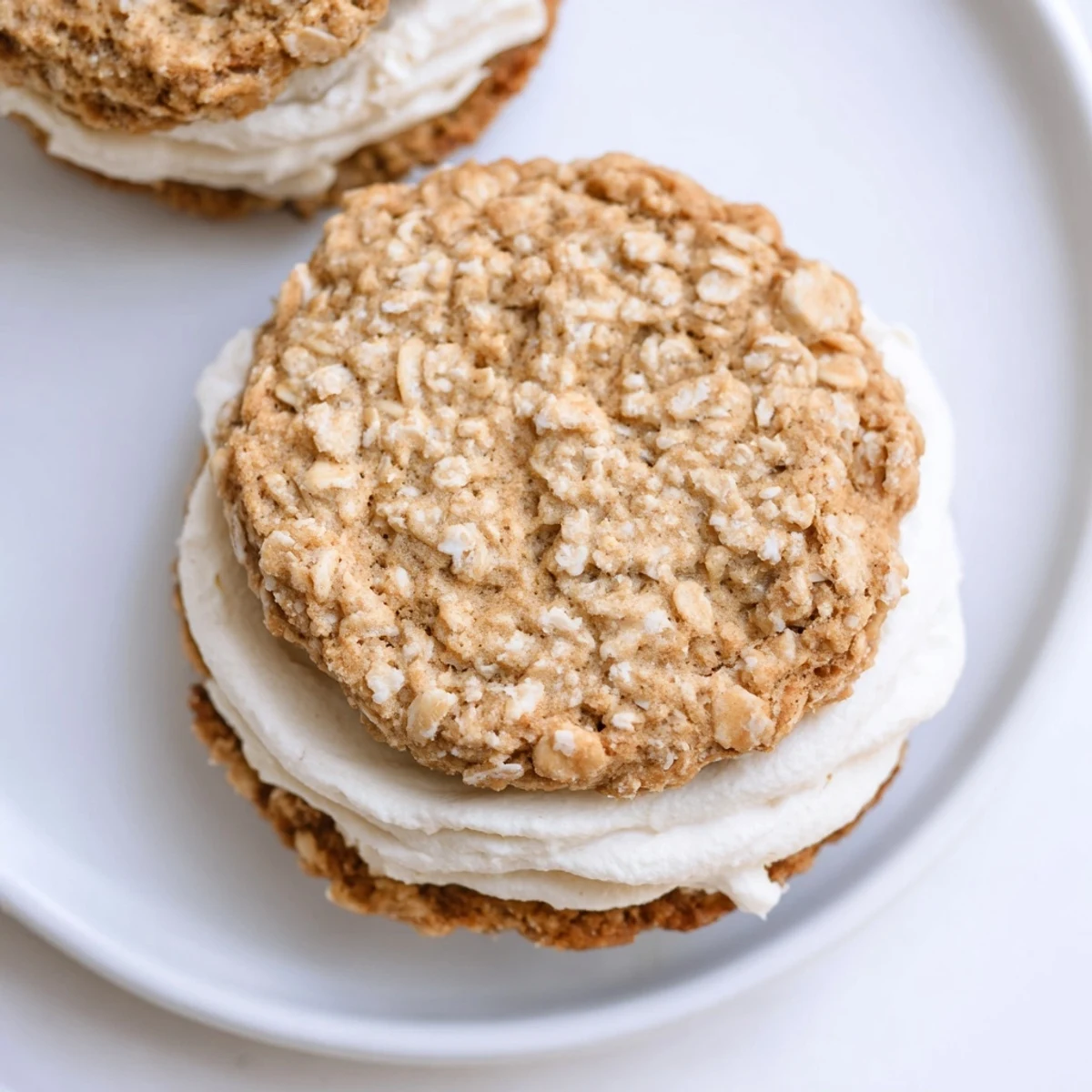 Freshly baked Gluten Free Oatmeal Creme Pies cooling on wire rack