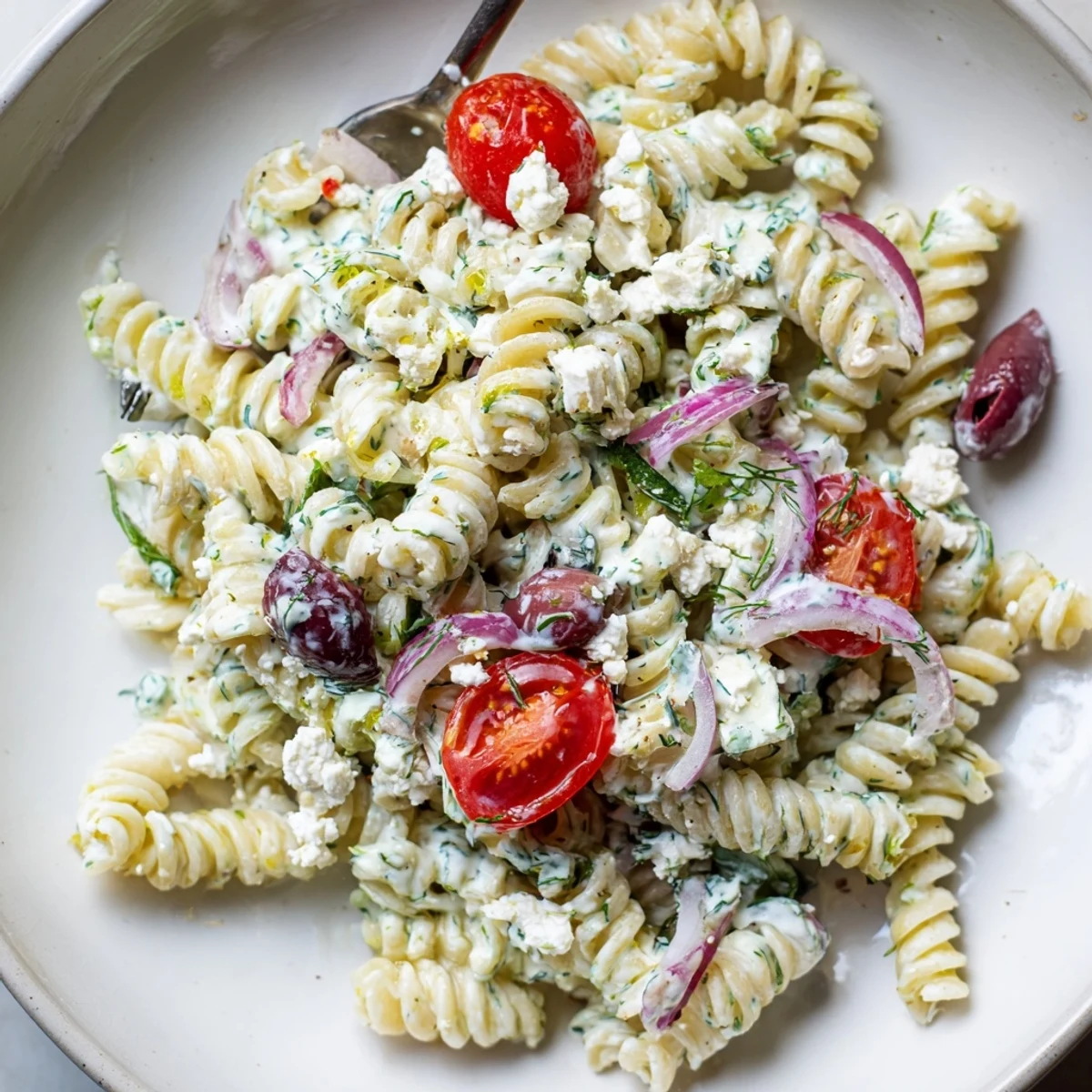 Weeknight Tzatziki Pasta Salad Mix with al dente pasta, garlic-scented herbs