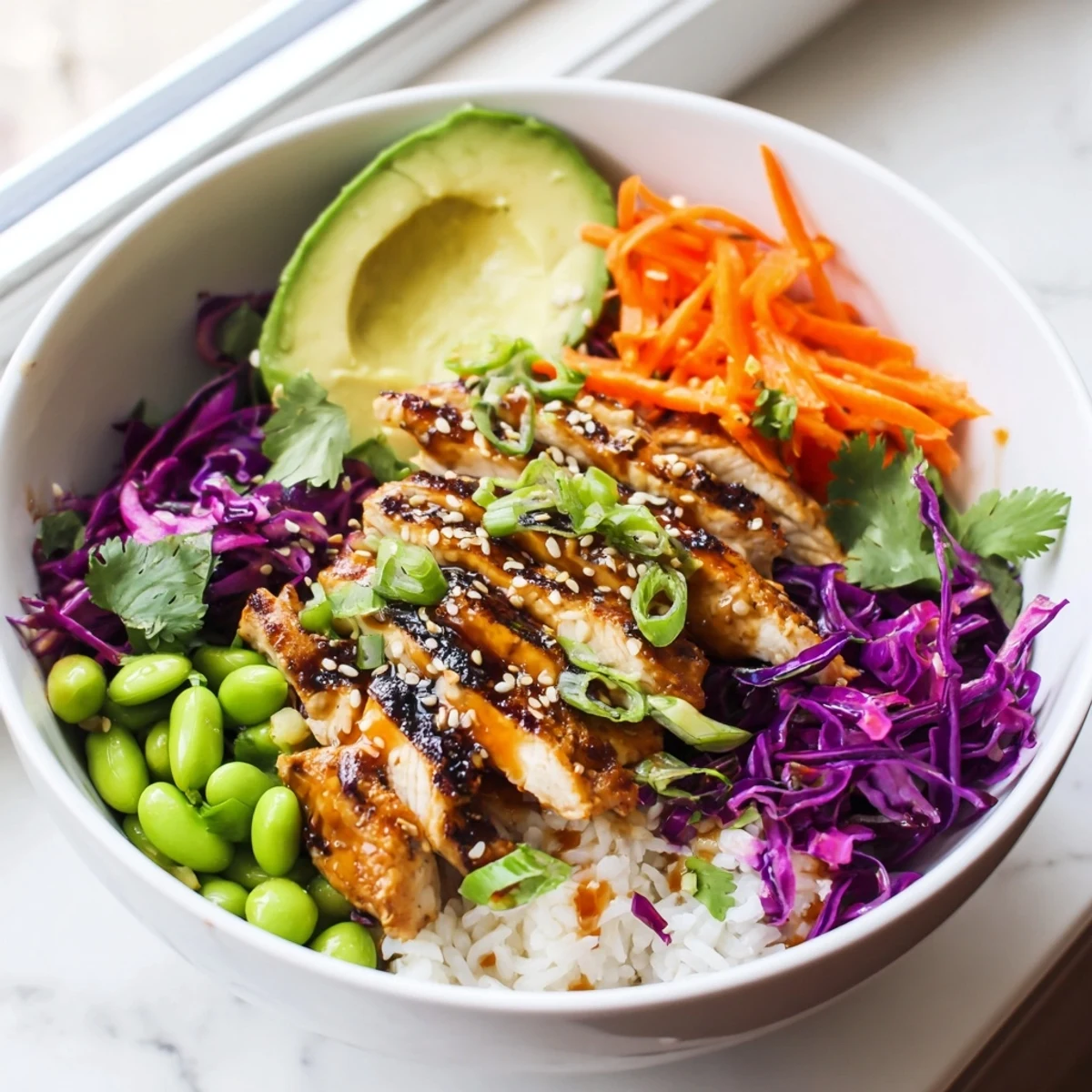 Golden marinated chicken strips served over rice in this Asian Inspired Chicken Power Bowl