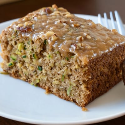 Warm Zucchini Cake With Brown Sugar Icing, nutty crumbs and gooey glaze